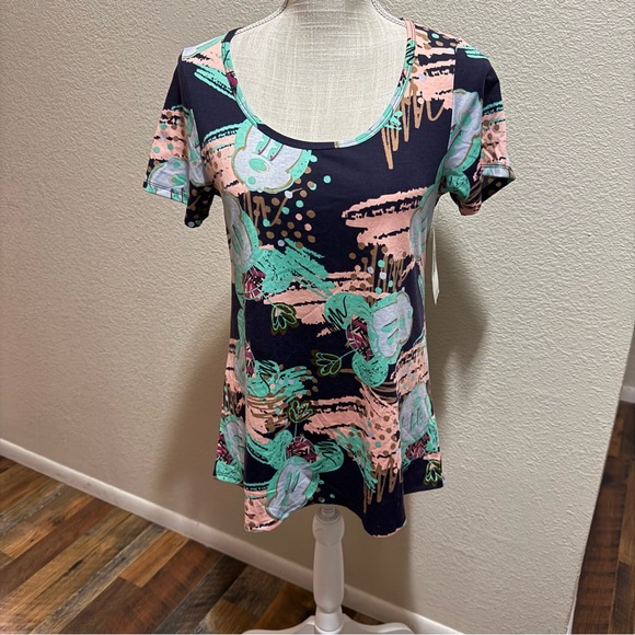 LuLaRoe Tops - 🤠 3/$20 Disney LuLaRoe Classic Top Pink & Green Design - Size XS - NWT